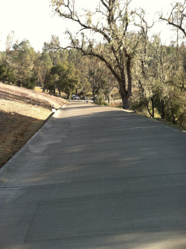 Over 10,000 foot long private gated community driveway completed by Creative Concrete & Design